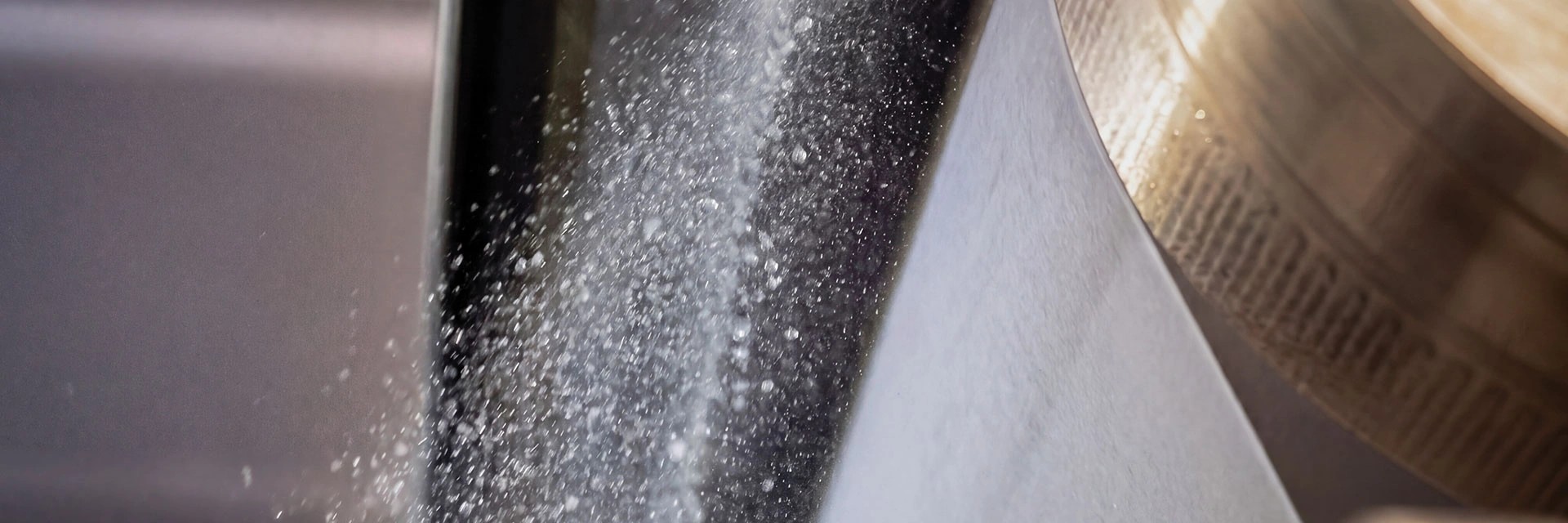 Close-up photo taken during the pultrusion process of a nonwoven fabric at DeatexGroup’s production facilities.